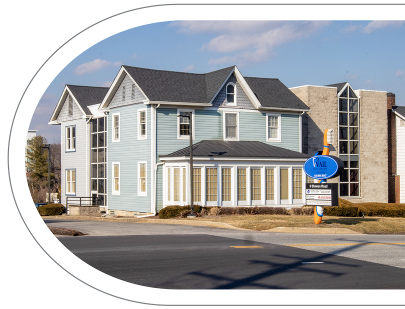 Vail Dental Associates in Hunt Valley, MD, 21030 office, which looks like a two-story blue house with glass-walled addition.