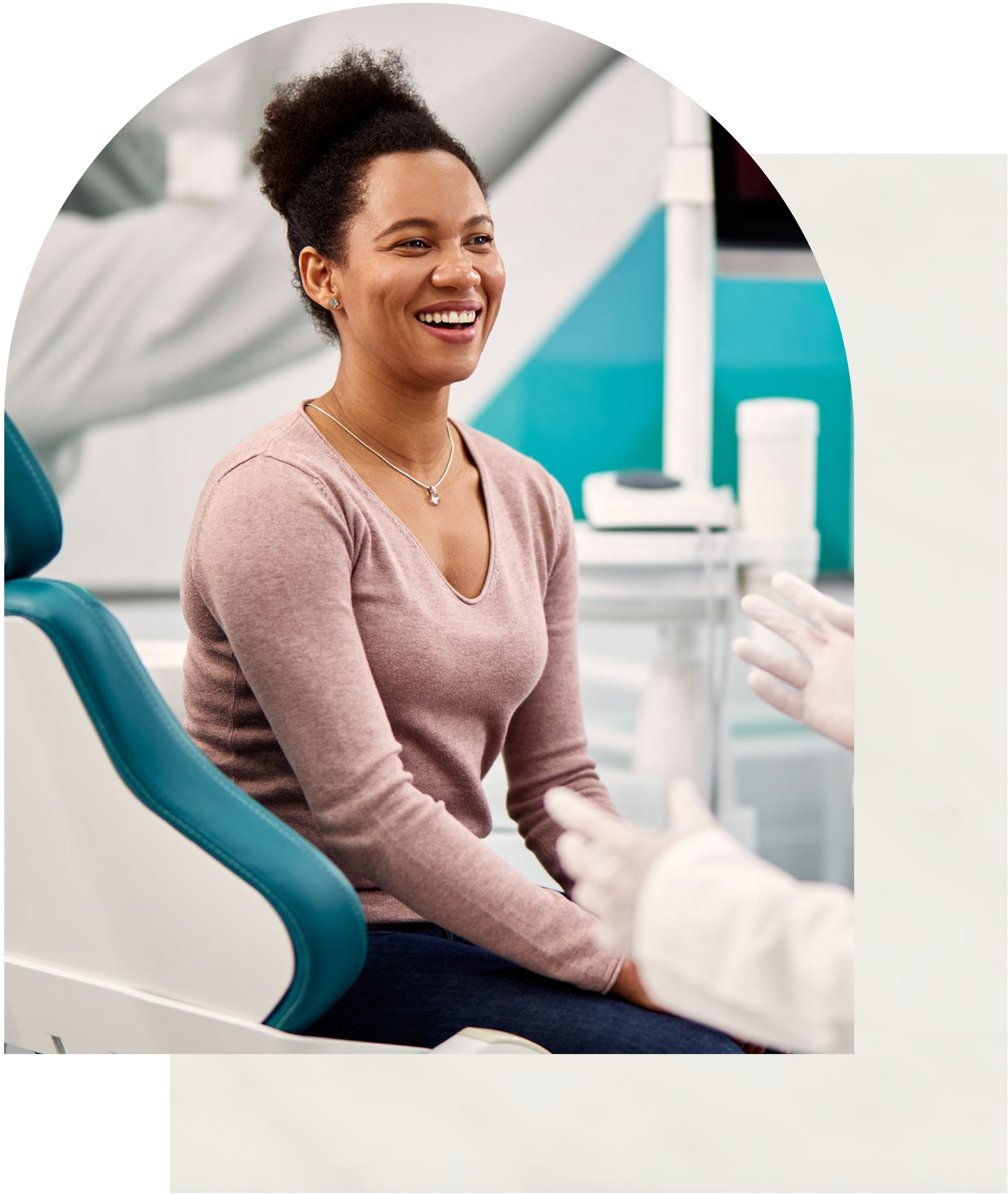 Woman smiling in a dental chair after dental cleaning at Vail Dental Associates in Hunt Valley, MD, 21030.