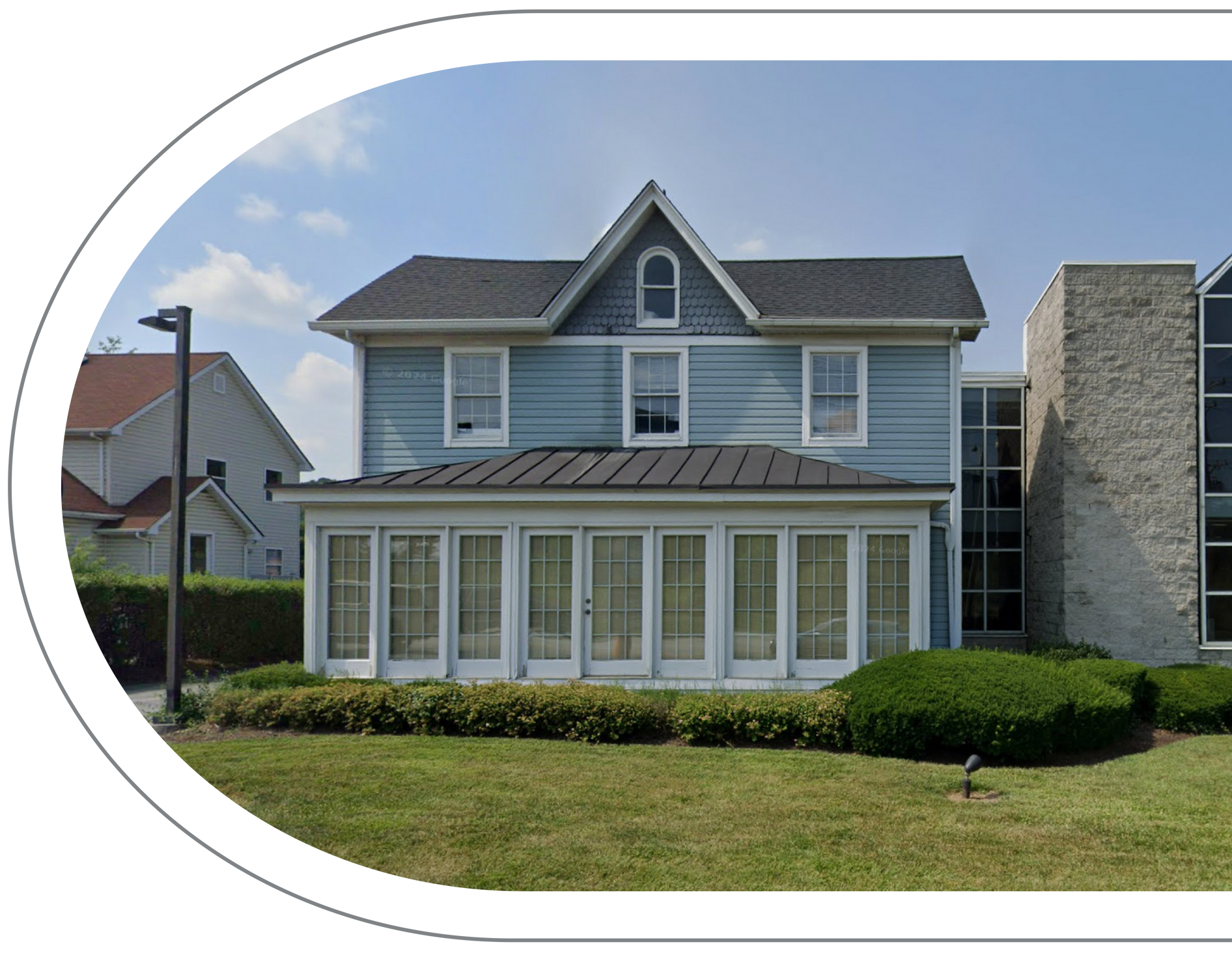 Vail Dental Associates in Hunt Valley, MD, 21030 office, which looks like a two-story blue house with glass-walled addition.