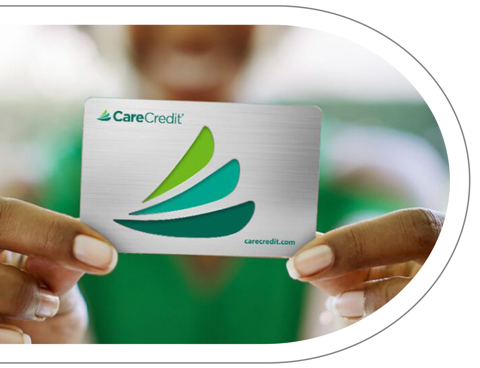 CareCredit card with a green and teal logo on a silver background. Available at at Vail Dental Associates in Hunt Valley.