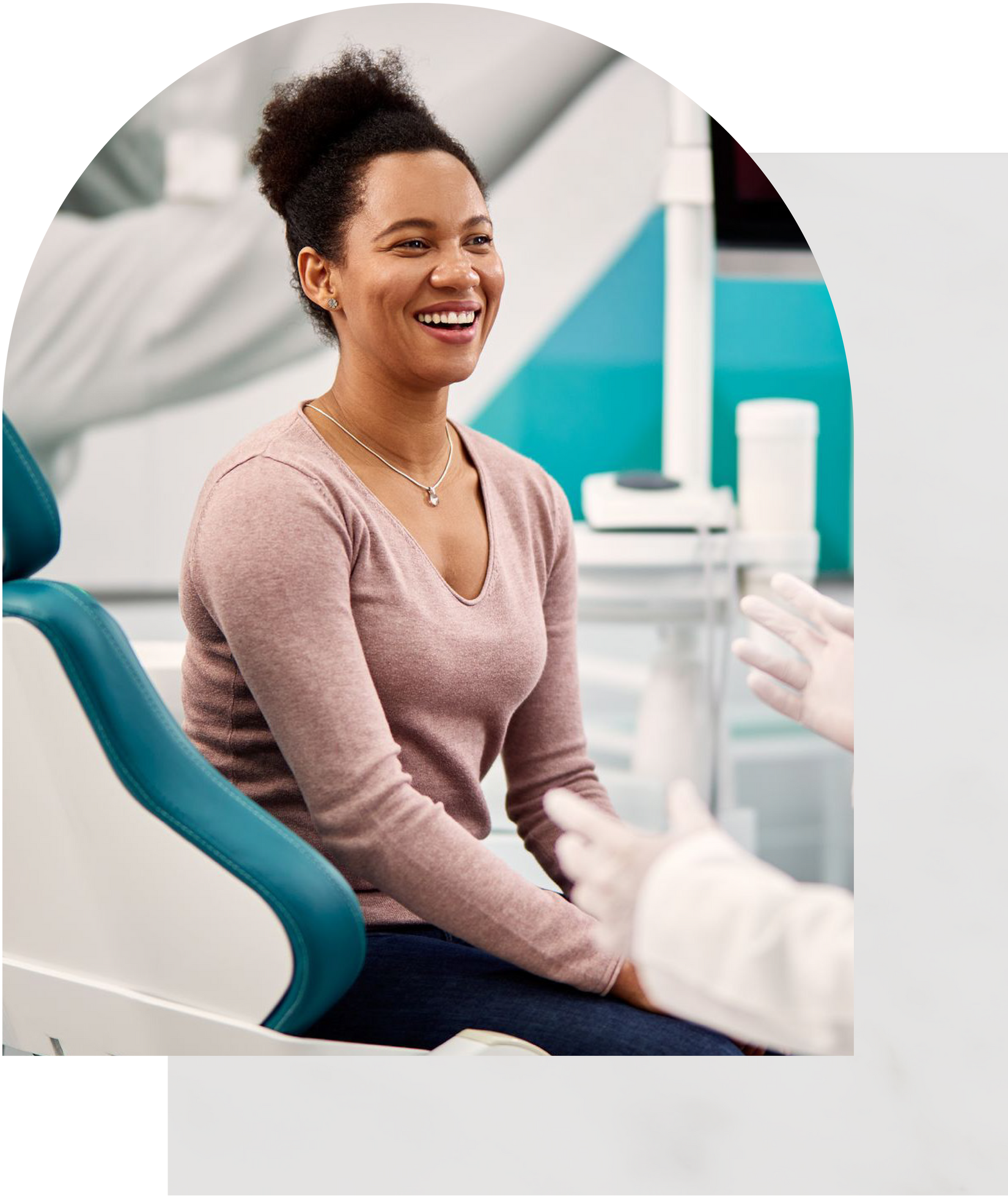 Woman smiling in a dental chair after dental cleaning at Vail Dental Associates in Hunt Valley, MD, 21030.