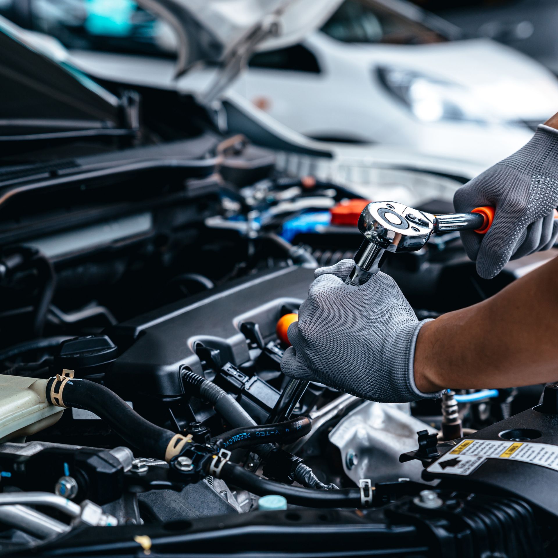 A Man Inspecting a Car's Under Carriage | West Allis, WI | Southtown Tire & Auto