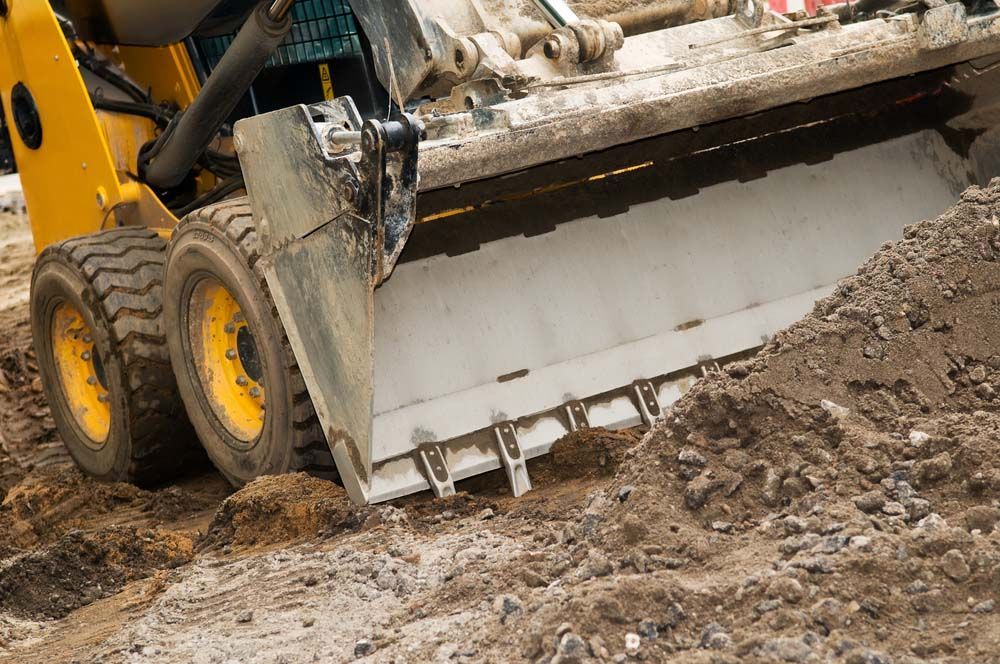 A bulldozer is moving dirt on a construction site.