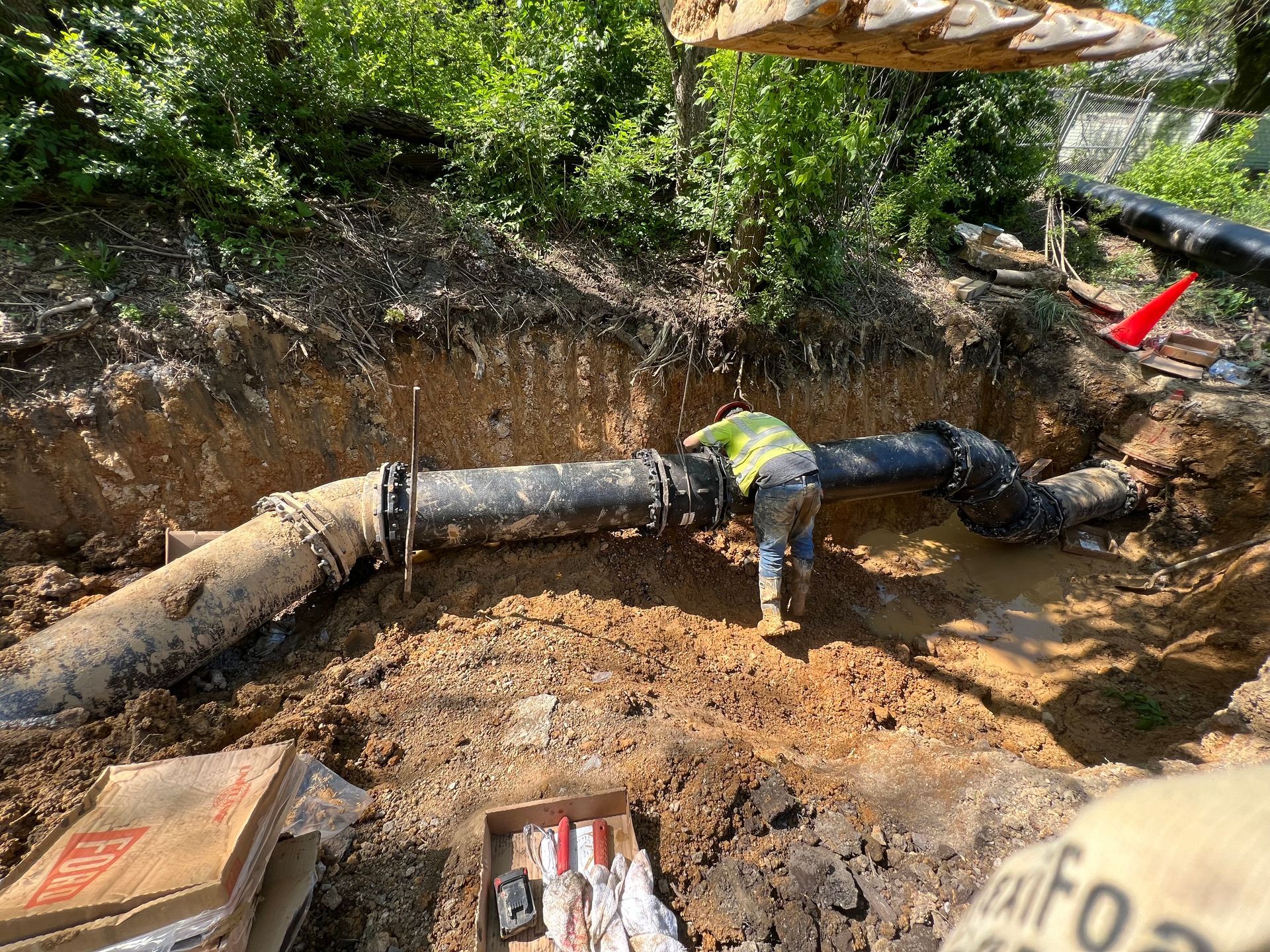 A pile of rocks is sitting on the ground in front of a building.