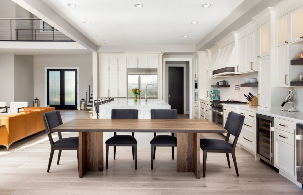 Modern Kitchen With a Wooden Dining Table — Carl Whelan Building & Renovations In Gosford, NSW