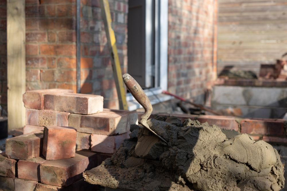 Bricklaying Construction Scene. Stack of Bricks, Mortar Pile — Carl Whelan Building & Renovations In Morisset, NSW
