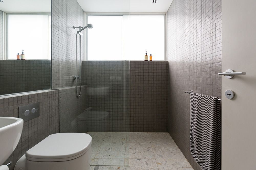 Modern Walk In Shower With Mosaic Full Height Tiles And Terrazzo Floor — Luxurious Bathroom Renovations in Narara, NSW