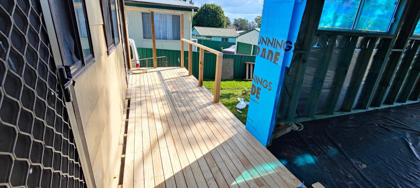 Wooden Deck Extending From a Building With Handrails — Carl Whelan Building & Renovations In Gosford, NSW