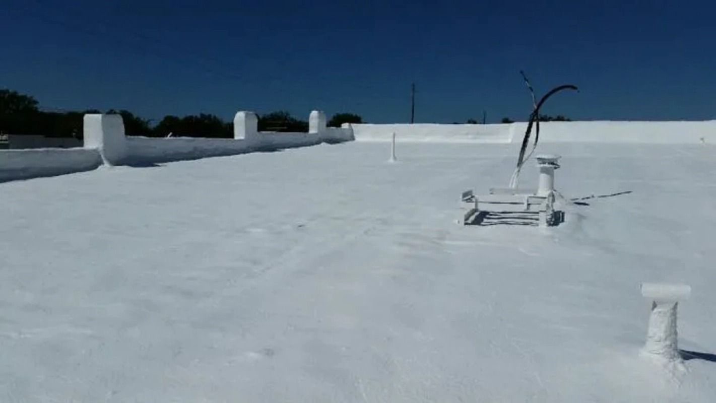 A white roof with a blue sky in the background.
