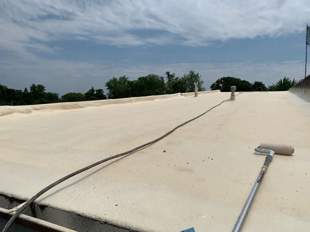 A roof with a rope and a roller on it.