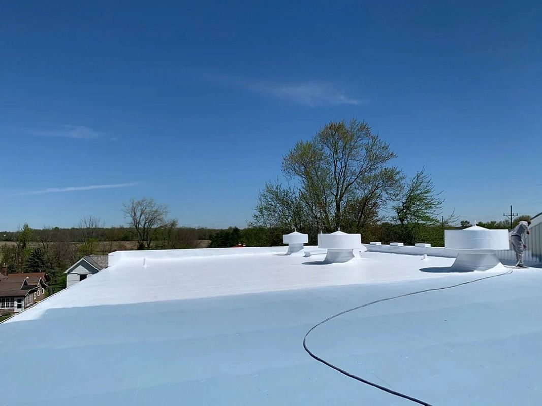 A white roof with a blue sky in the background.