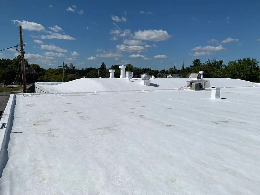 A white roof with a blue sky in the background.