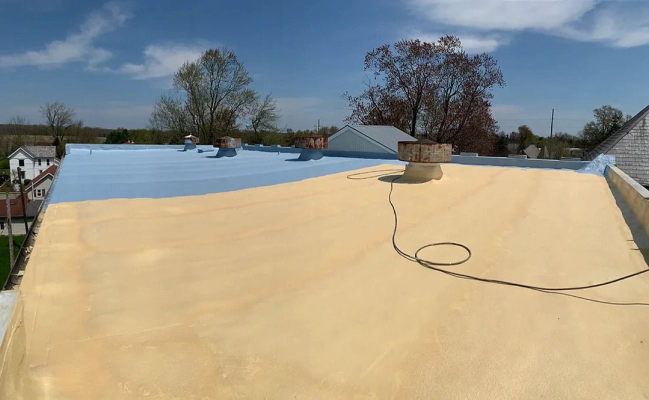 A large roof with a chimney on top of it.