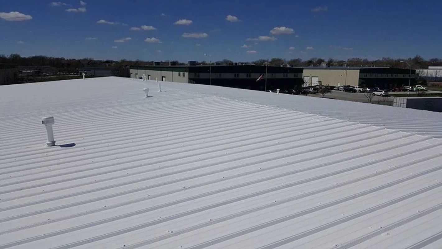 A white roof with a blue sky in the background.