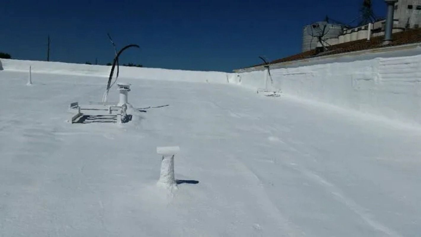 A white roof with a blue sky in the background.