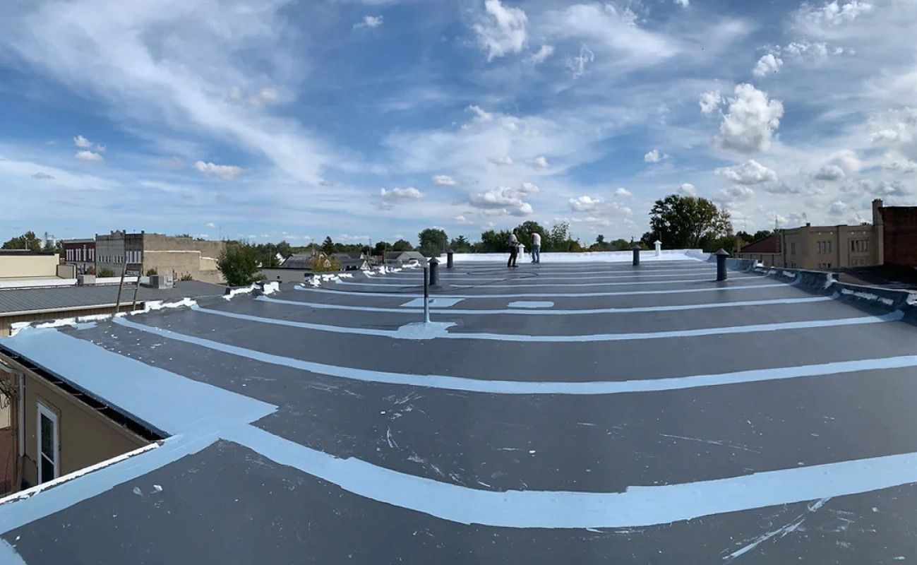 A large roof with a blue sky in the background.