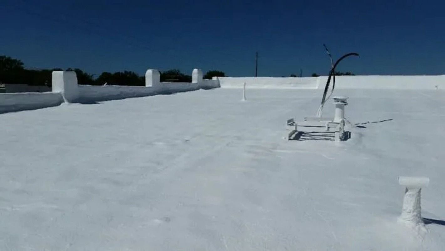 A white roof with a blue sky in the background.