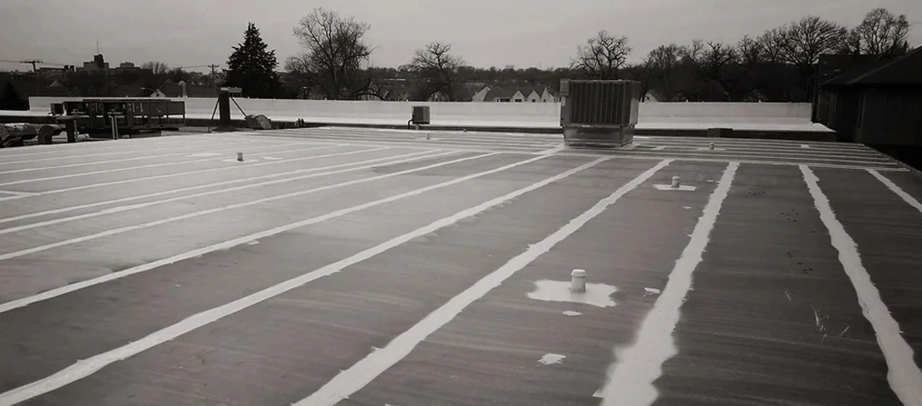 A black and white photo of an empty parking lot