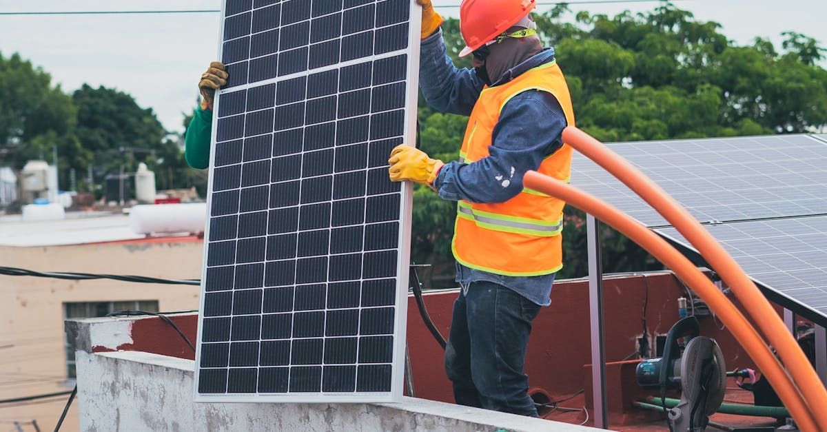 Electrician installing solar panel system | Solid Power Communications – Expert solar panel installation in Denver