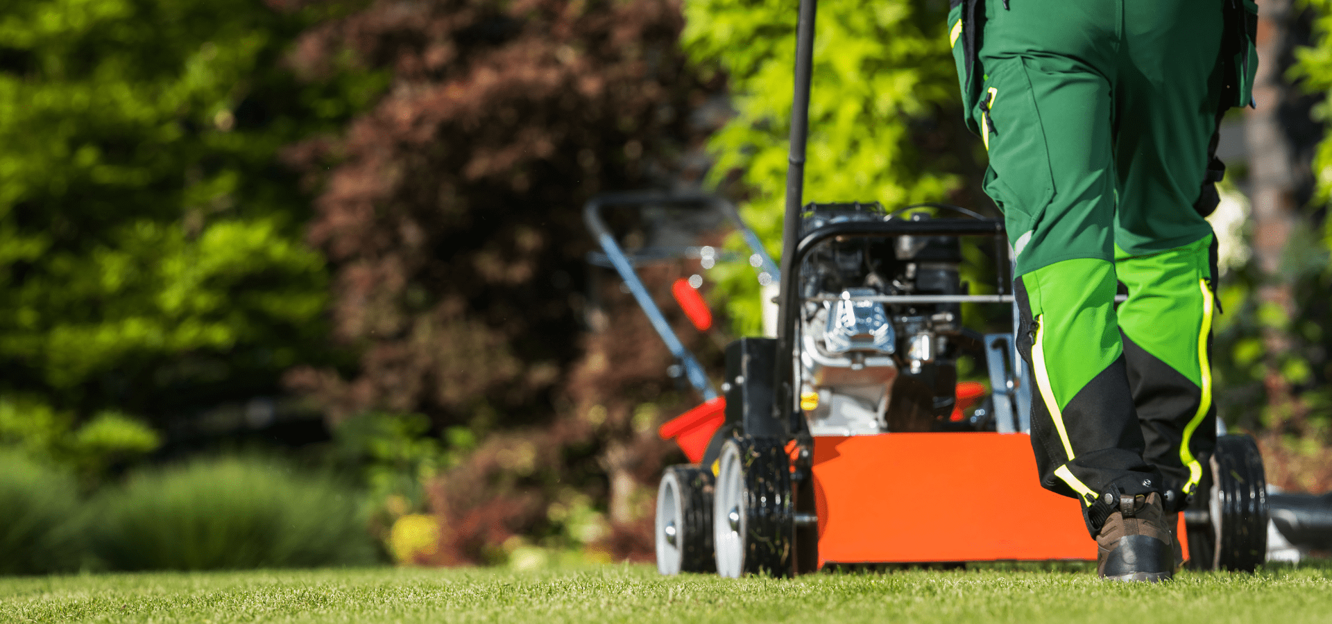 Professional Landscaper From Richmond Landscapes Is Using The Lawn Mower For Lawn Maintenance In Richmond Home