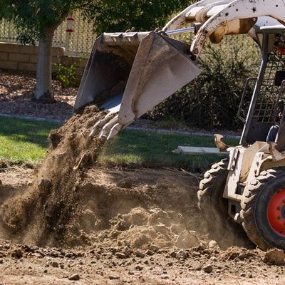 Affordable Landscaping — Small Bulldozer Digging in the Yard in Bellingham, WA