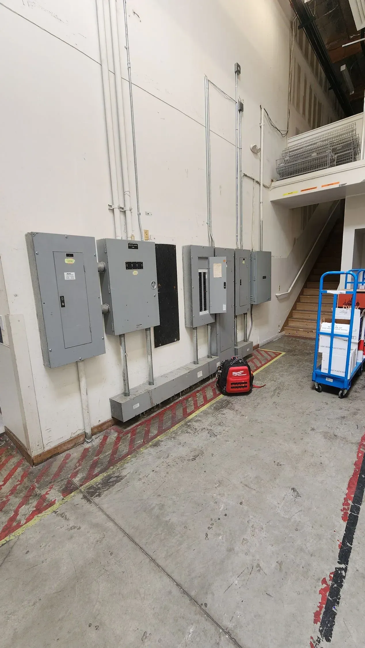 A warehouse with a lot of electrical panels on the wall.