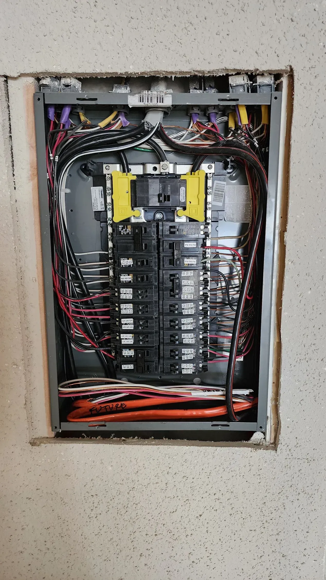 A electrical box with a lot of wires coming out of it.