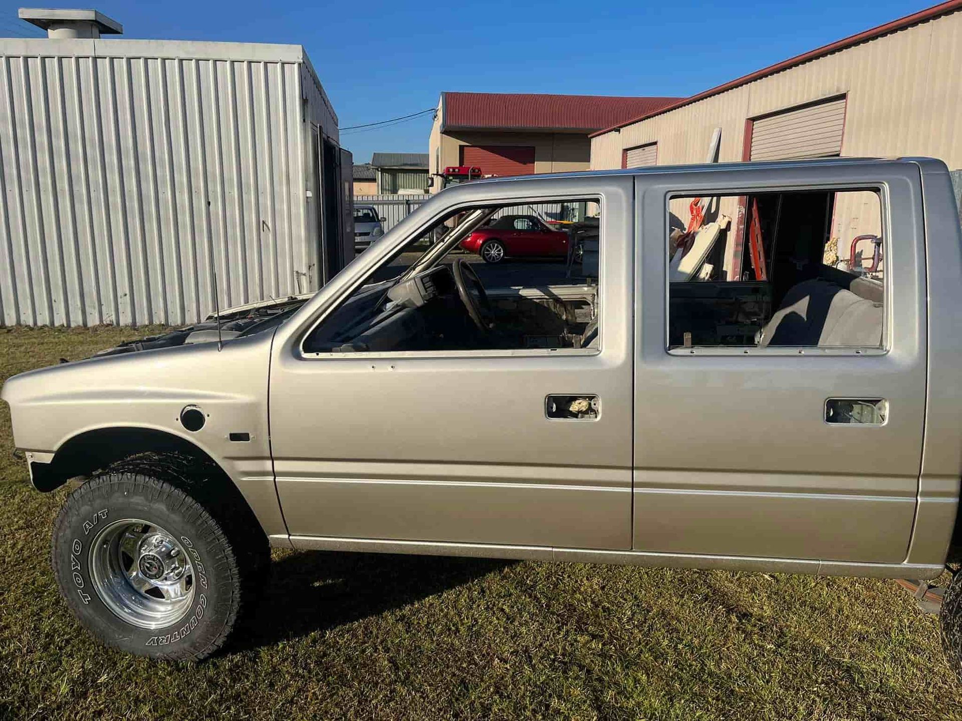a Jeep is Sitting in a Garage With Its Hood Up. — FSK Paint & Panel in Casino, NSW 