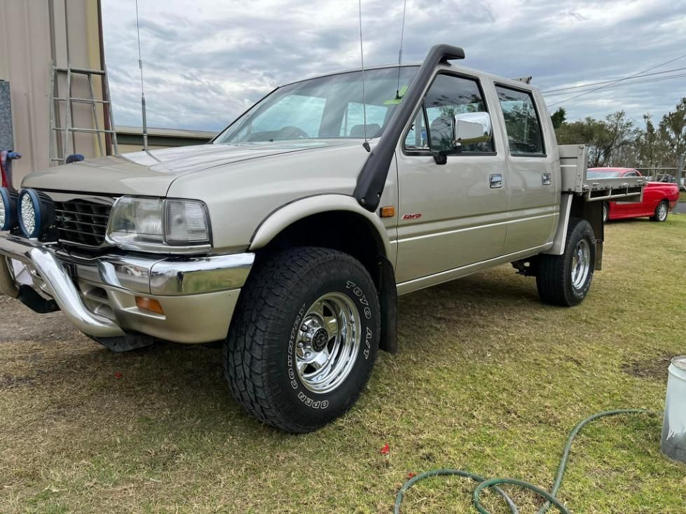 a Pickup Truck With a Snorkel is Parked in a Field. — FSK Paint & Panel in Casino, NSW 