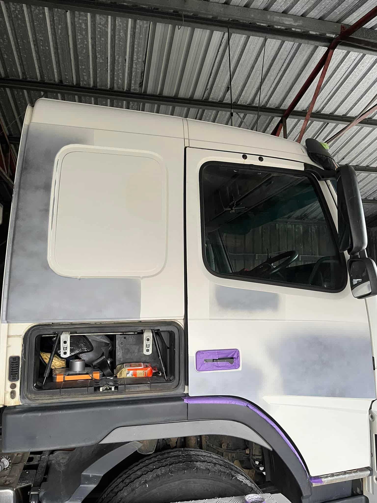a White Truck is Parked Under a Roof in a Garage. — FSK Paint & Panel in Casino, NSW 