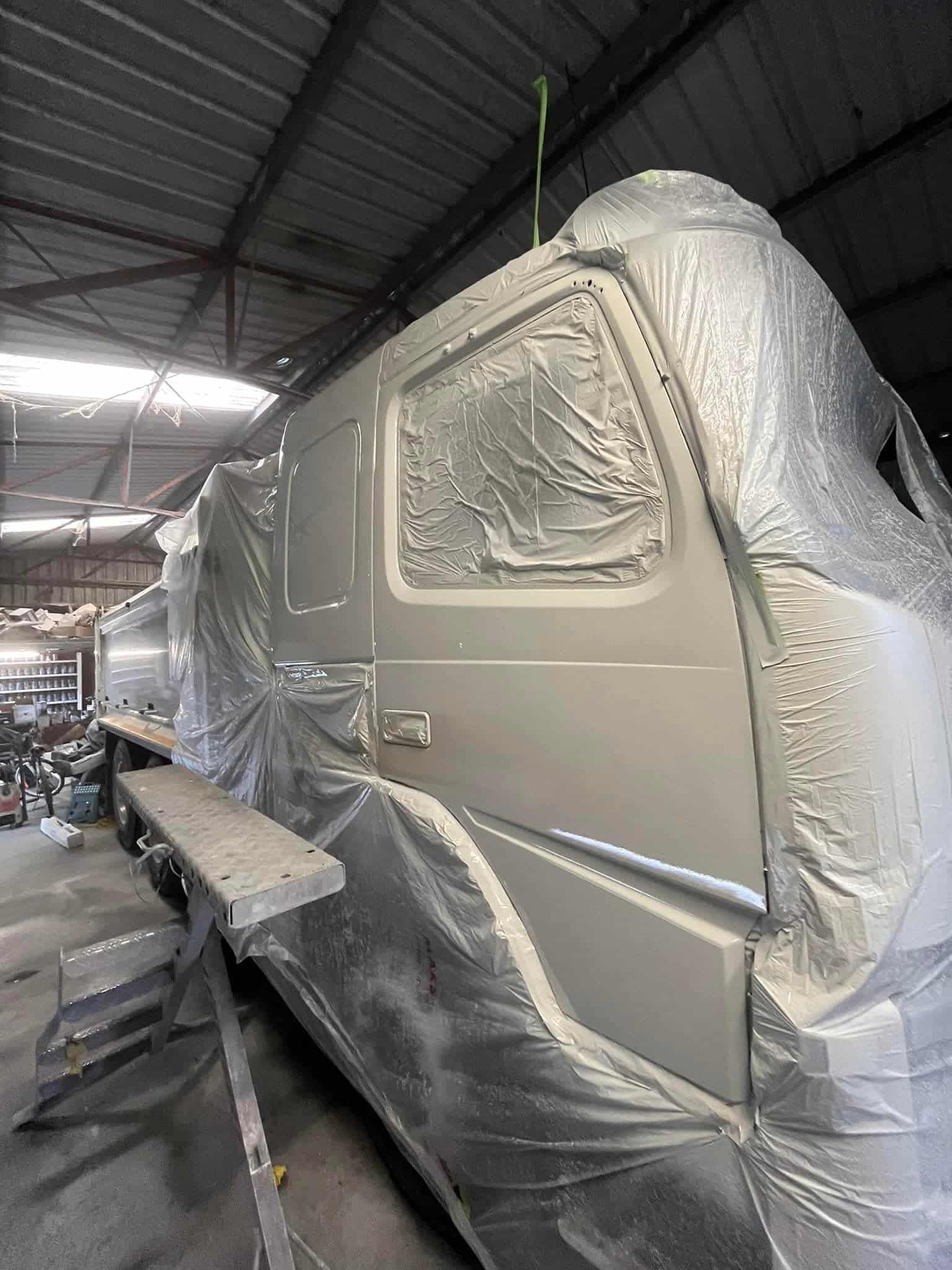 a Truck is Being Painted in a Garage. — FSK Paint & Panel in Casino, NSW  