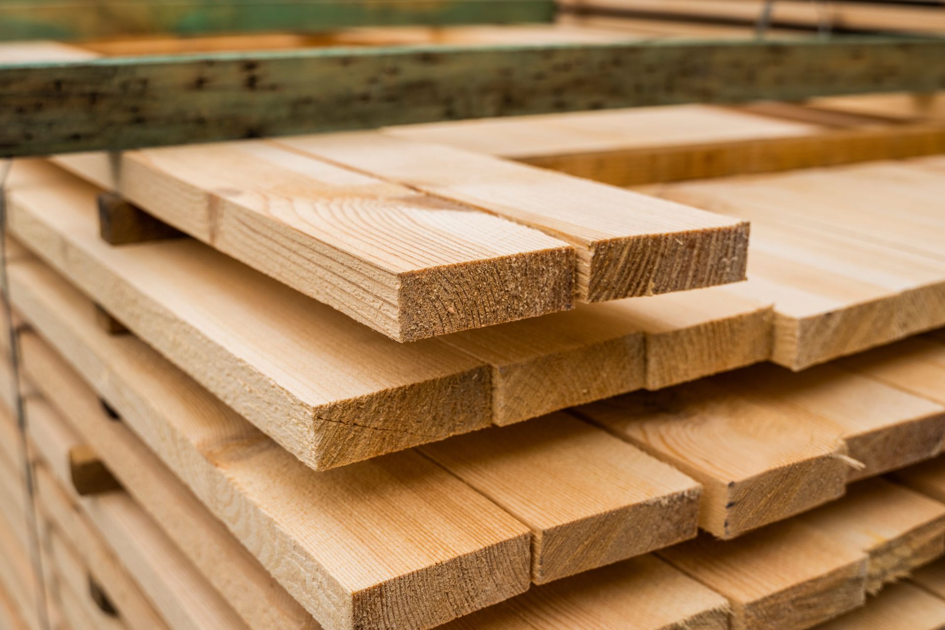 Piles of wooden boards at a lumber store.