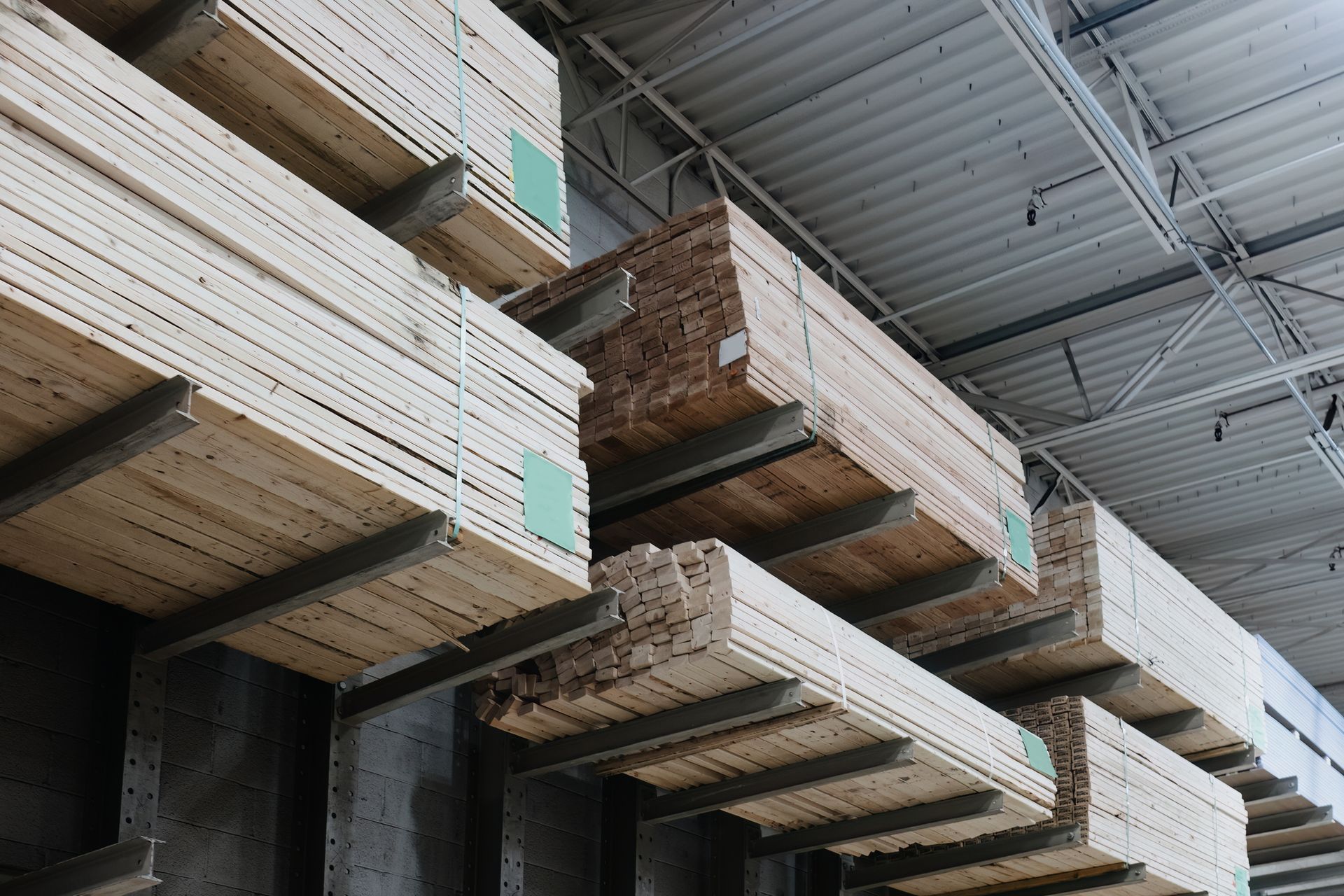 Lumber stacked on shelves at home improvement store Lumber stacked on shelves at home improvement store