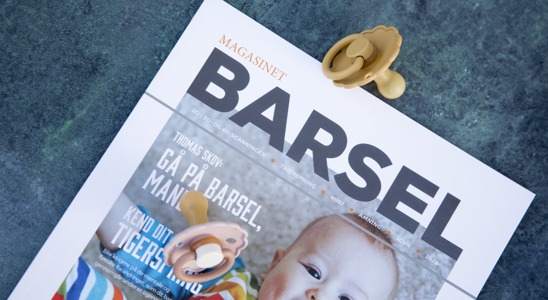 Forsiden af Magasinet Barsel med en baby på forsiden. Magasinet udgives af mediebureauet nord