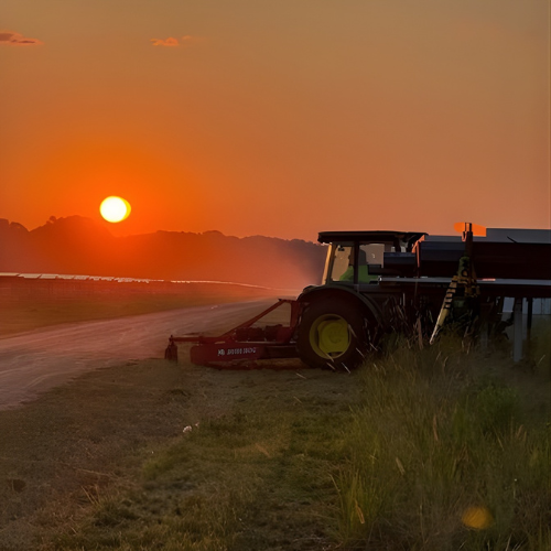Yellow and black track skid steer with the words 