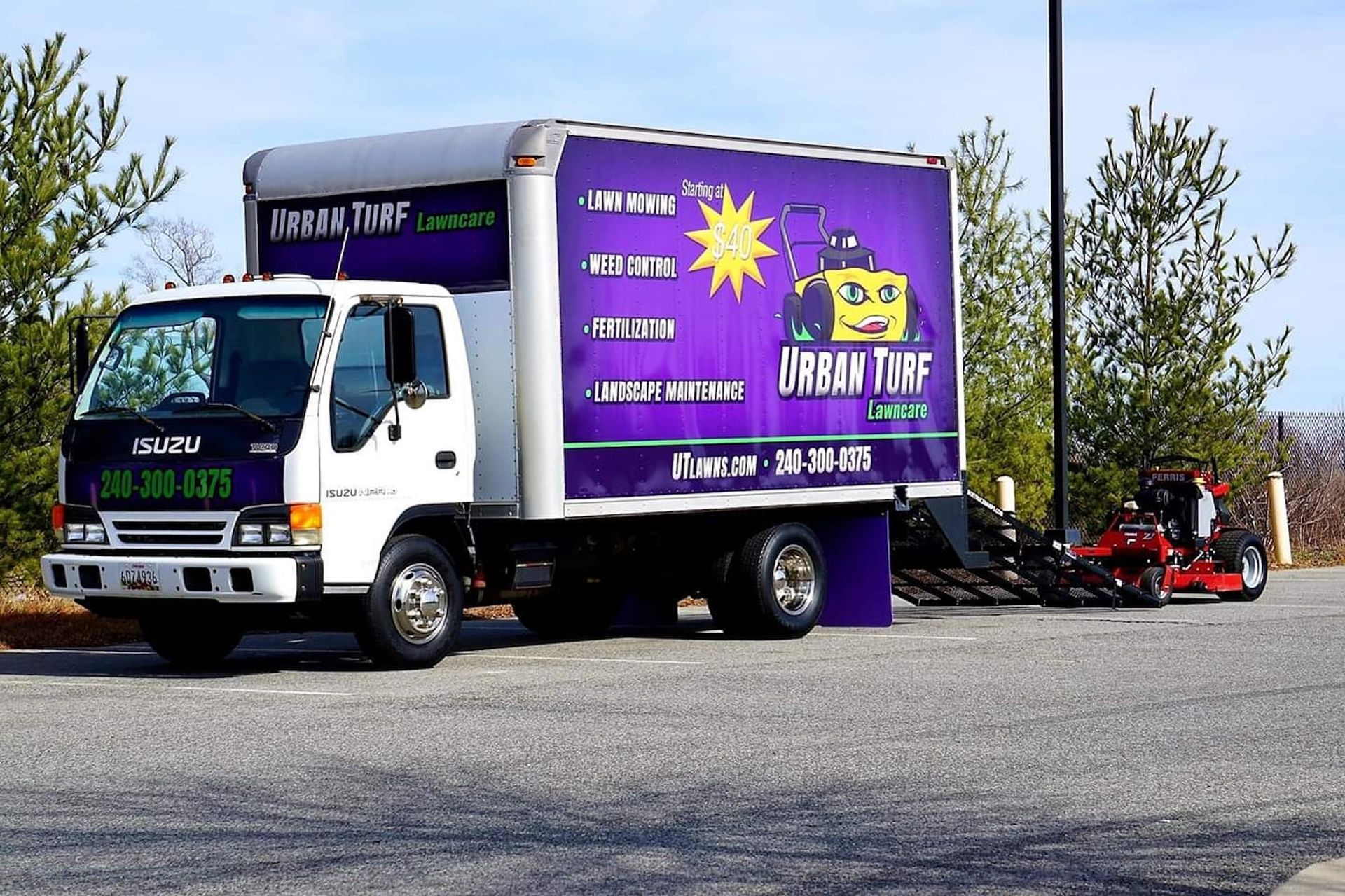 A white truck with a purple box that says junk tune on it