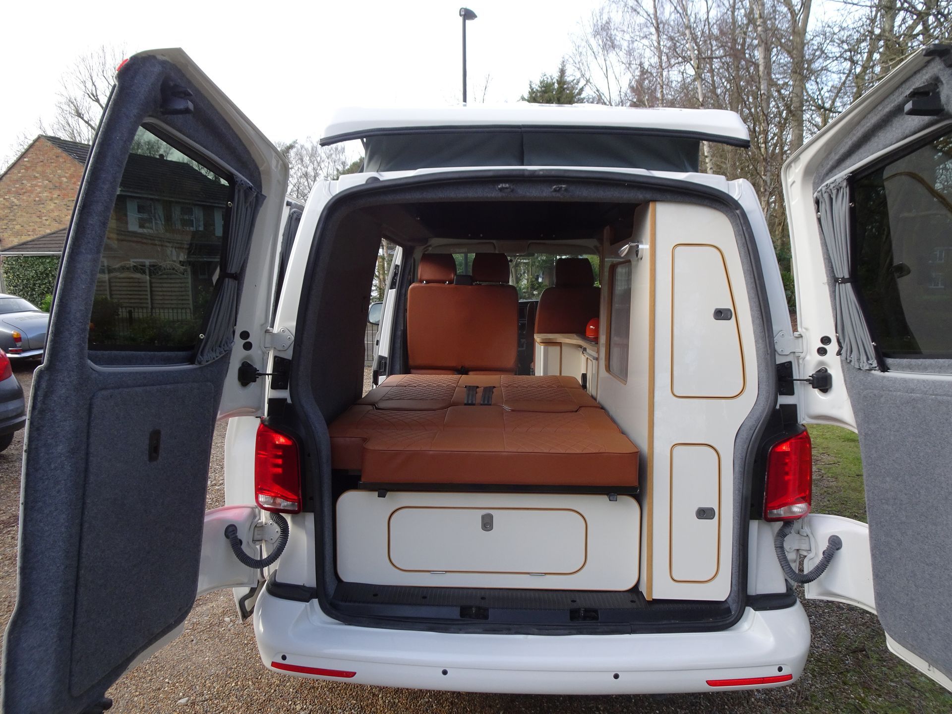 The back of a white van with the doors open