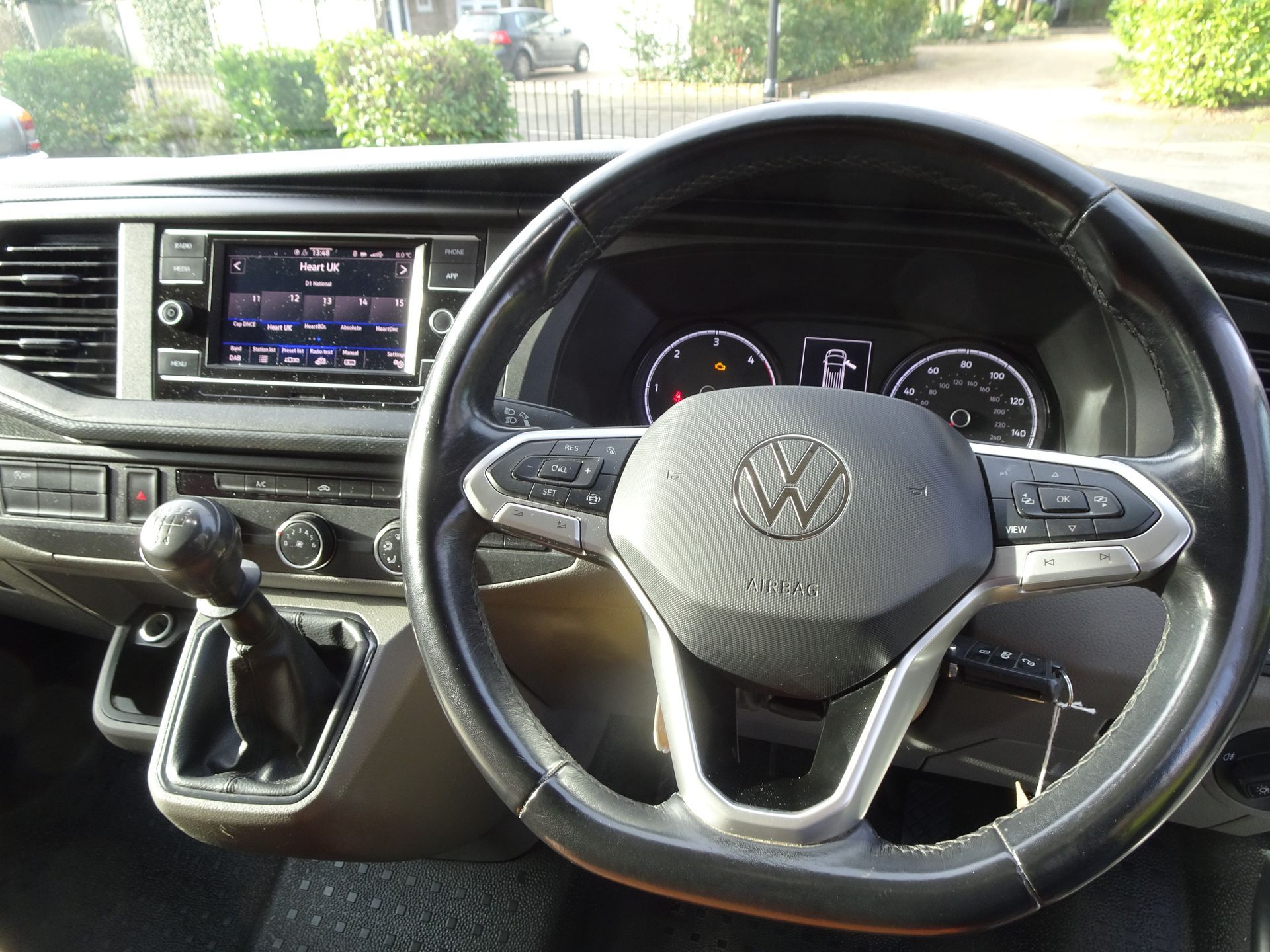 A close up of a steering wheel in a car