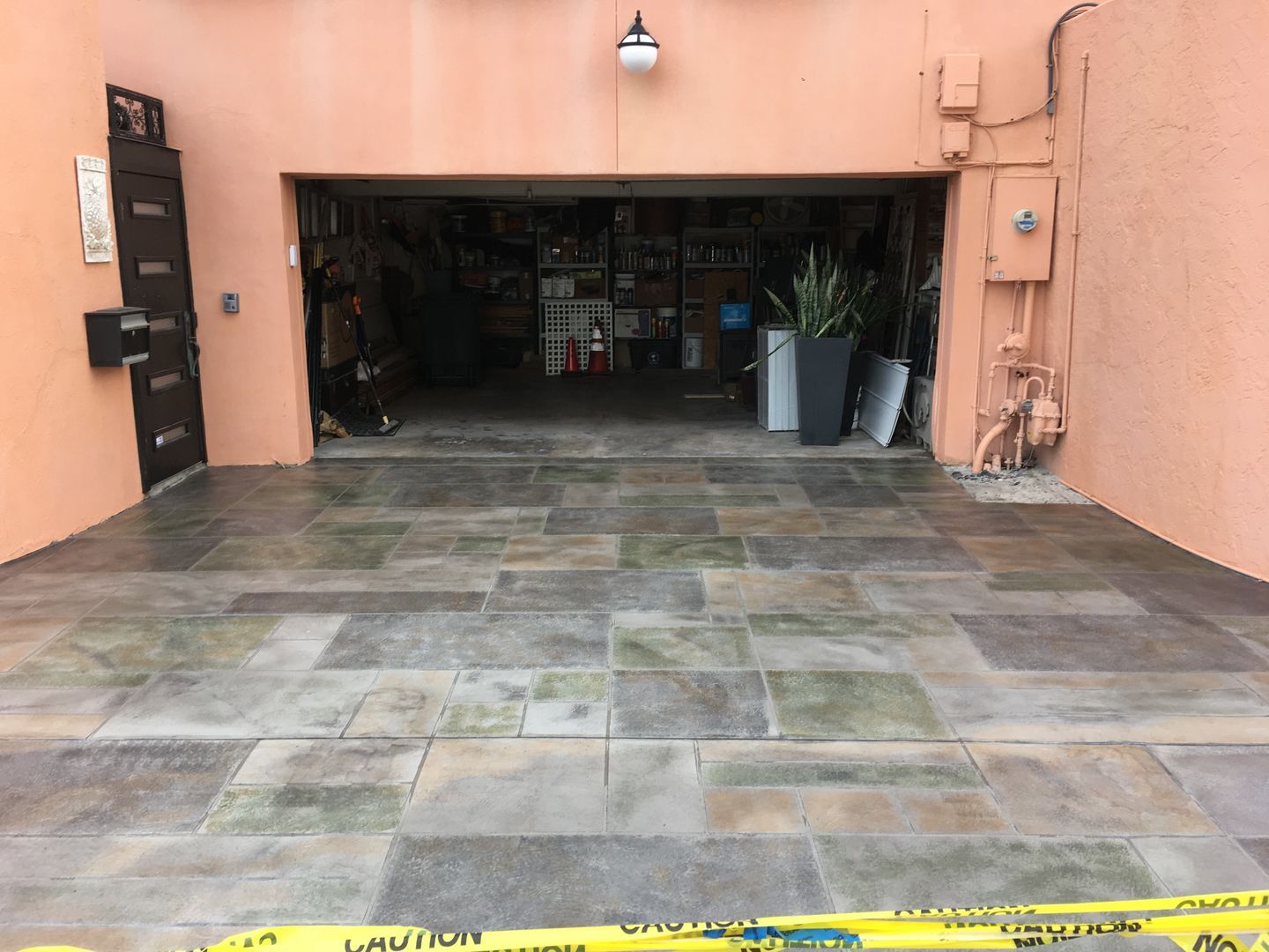A screened in porch with a swimming pool in the background