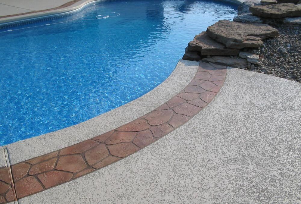 Knock Down Pool Deck Resurfacing with Cobblestone Pattern on Coping