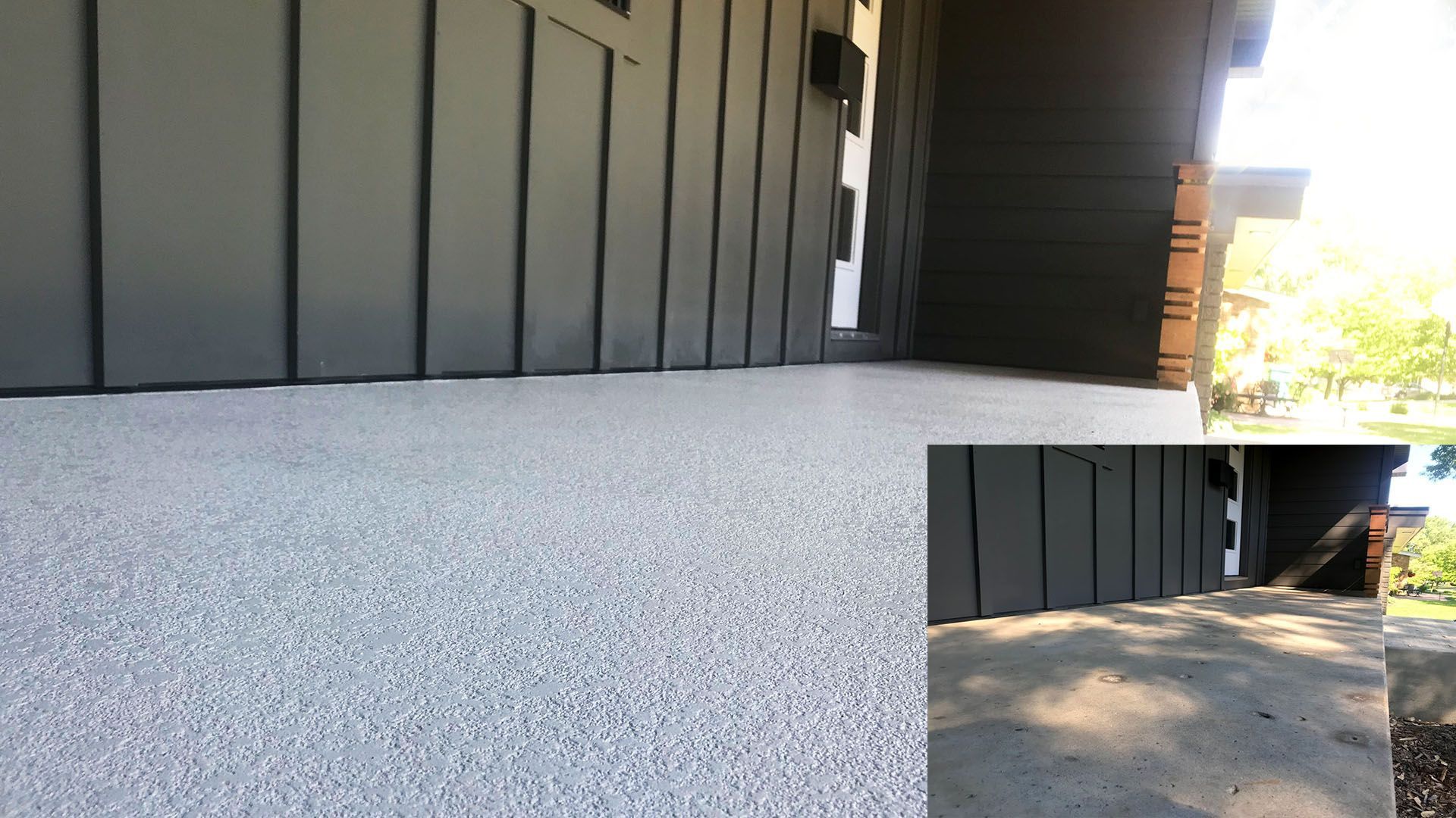 A screened in porch with a brick house in the background.