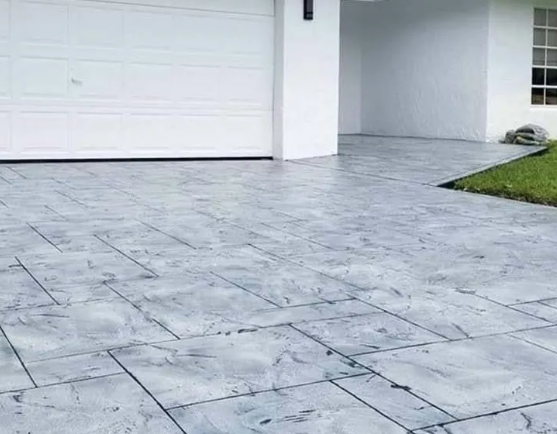 A screened in porch with a brick house in the background.