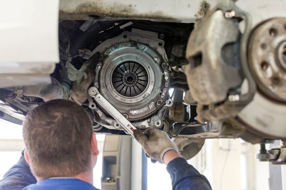 Man Checking The Clutch Of A Vehicle