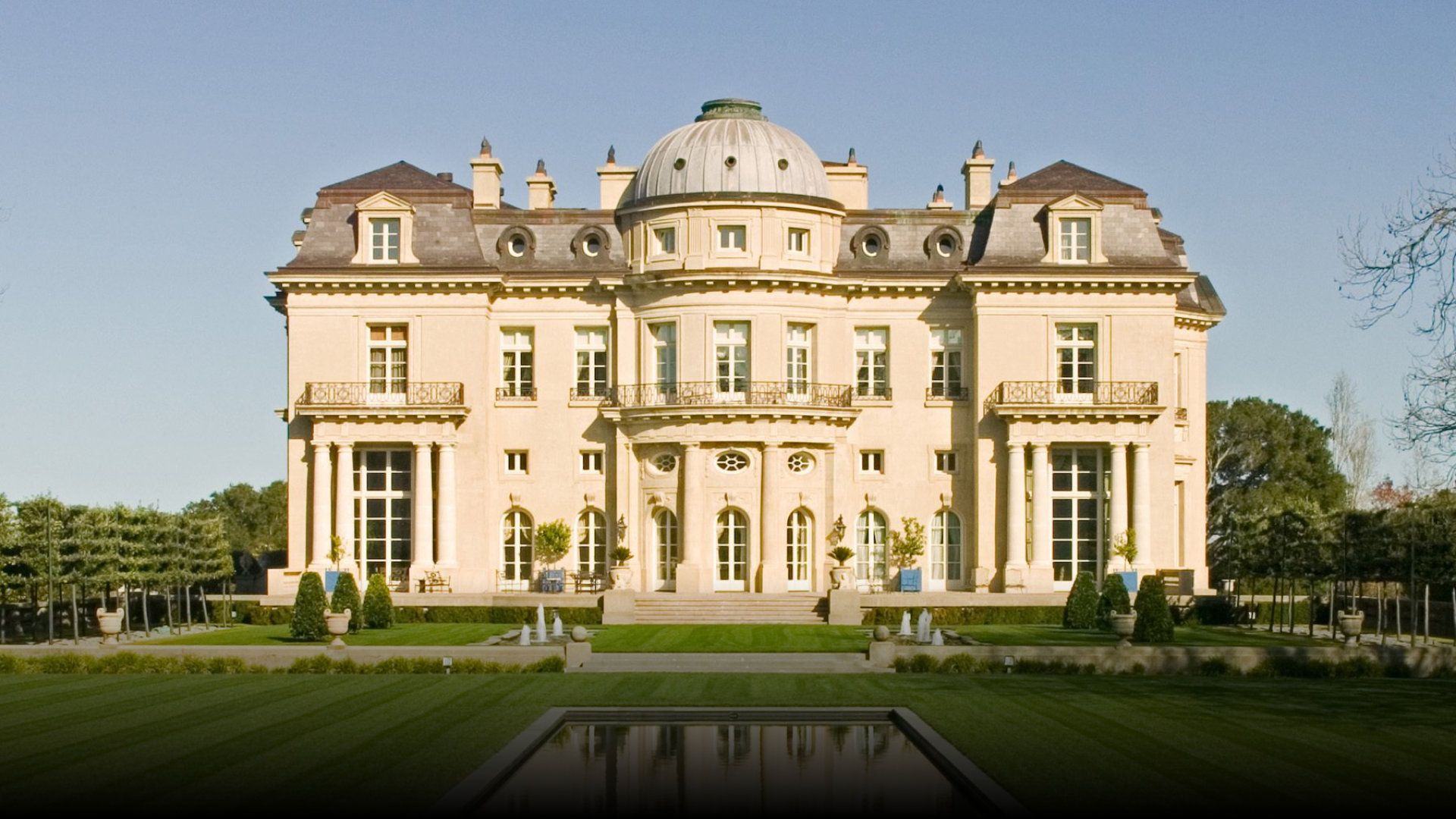 A large white building with a dome on top of it