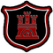 A red and black shield with a castle on it.