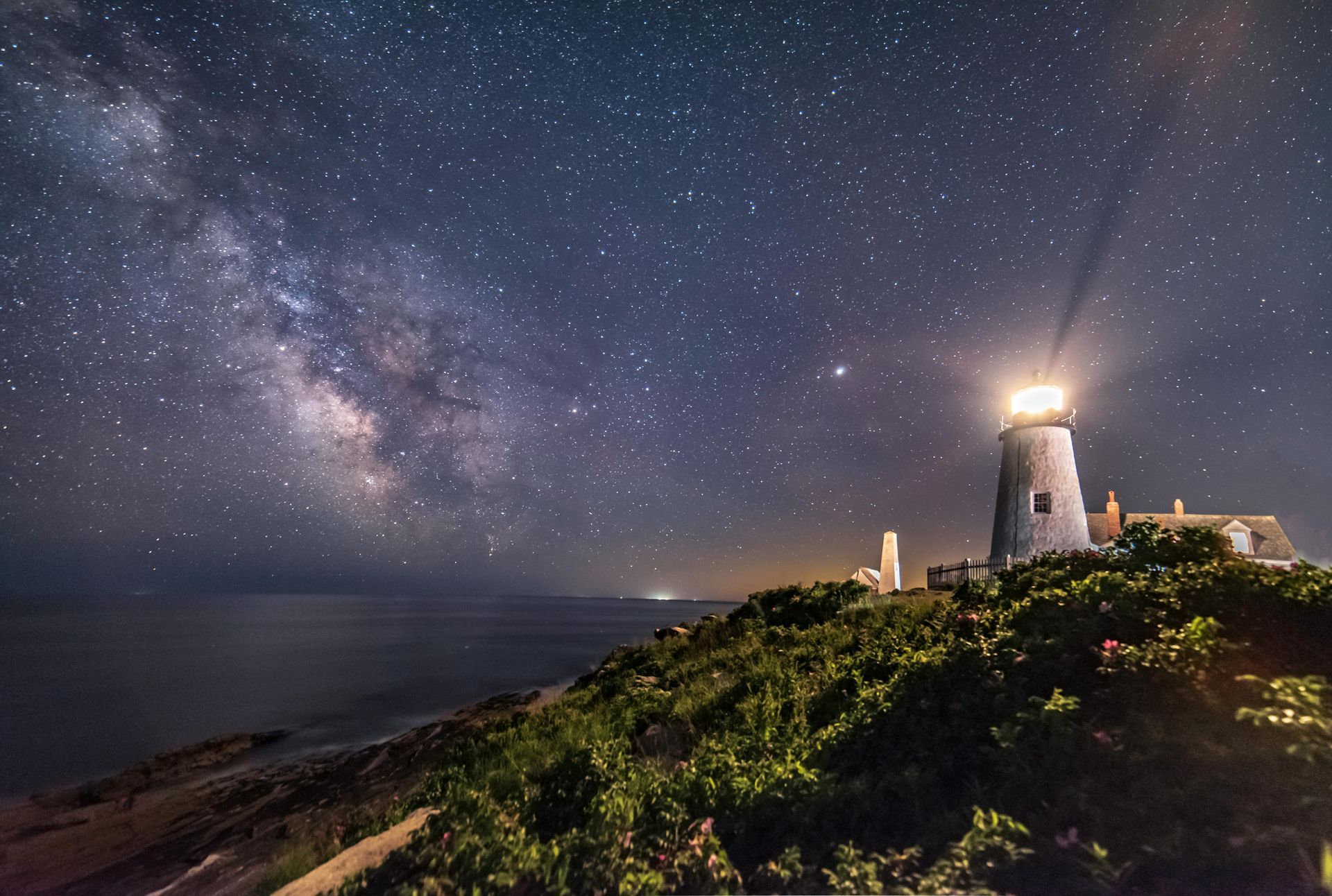Lighthouse in front of a Milky Way Galaxy sky