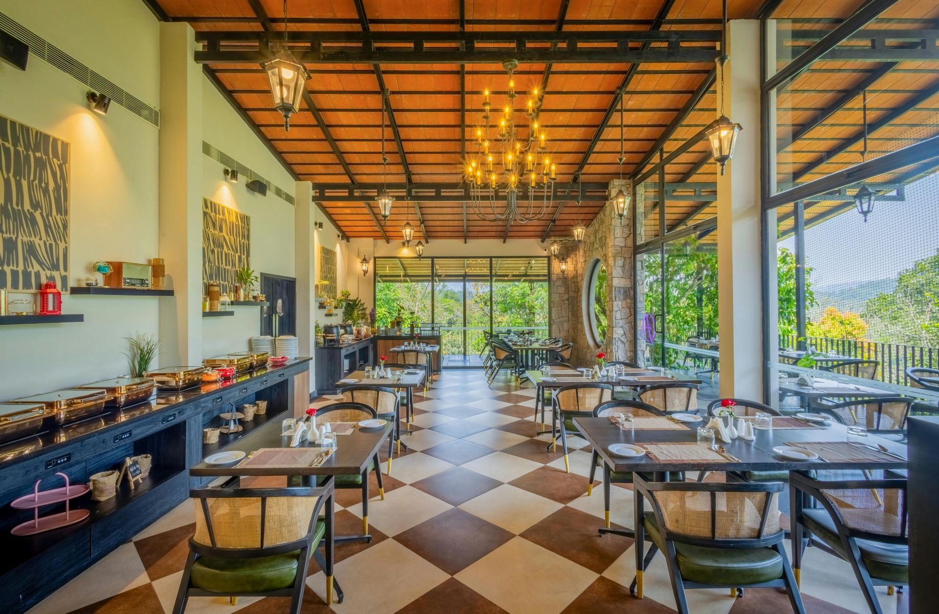 Open-air restaurant dining room with checkered floor, wooden tables, and warm hanging lights