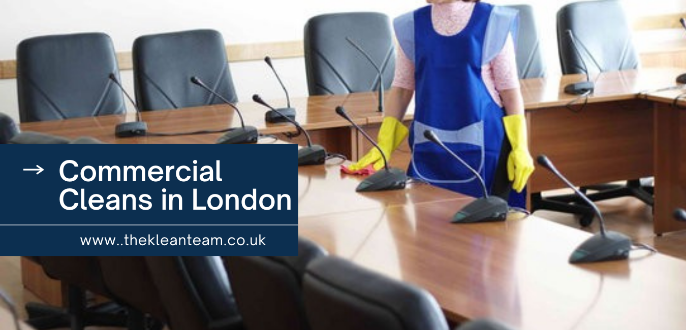 A woman is cleaning a conference room with a sign that says commercial cleans in london