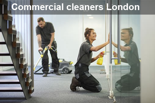 A man and a woman are cleaning a building.