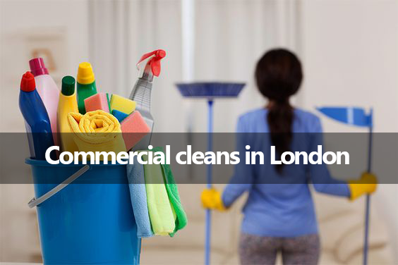 A woman is holding a mop and a bucket of cleaning supplies in front of a sign that says commercial cleans in london